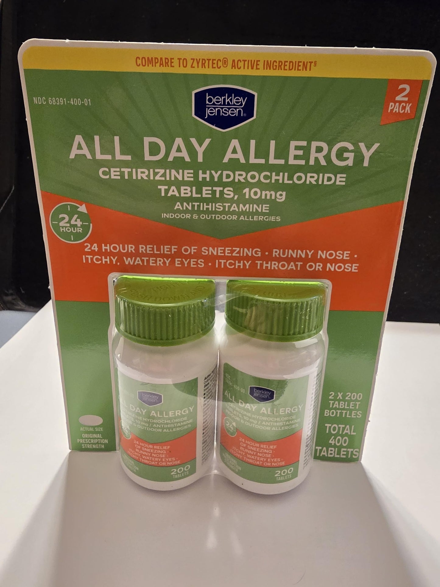 Easy to swallow allergy medicine tablets beside the original imported packaging bottle