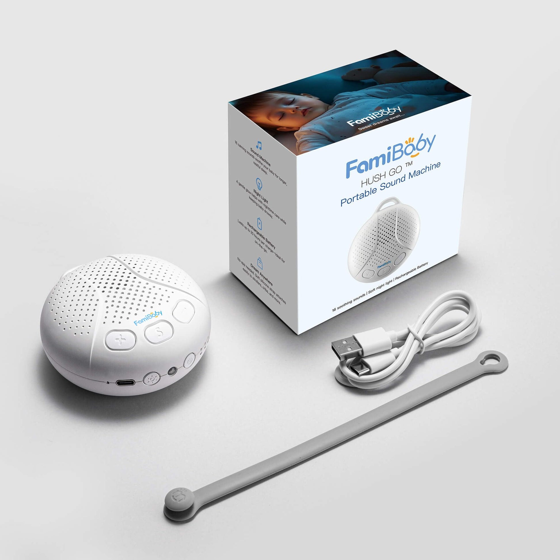 FamiBaby white noise machine packaging and included USB charging cable displayed on a clean background.