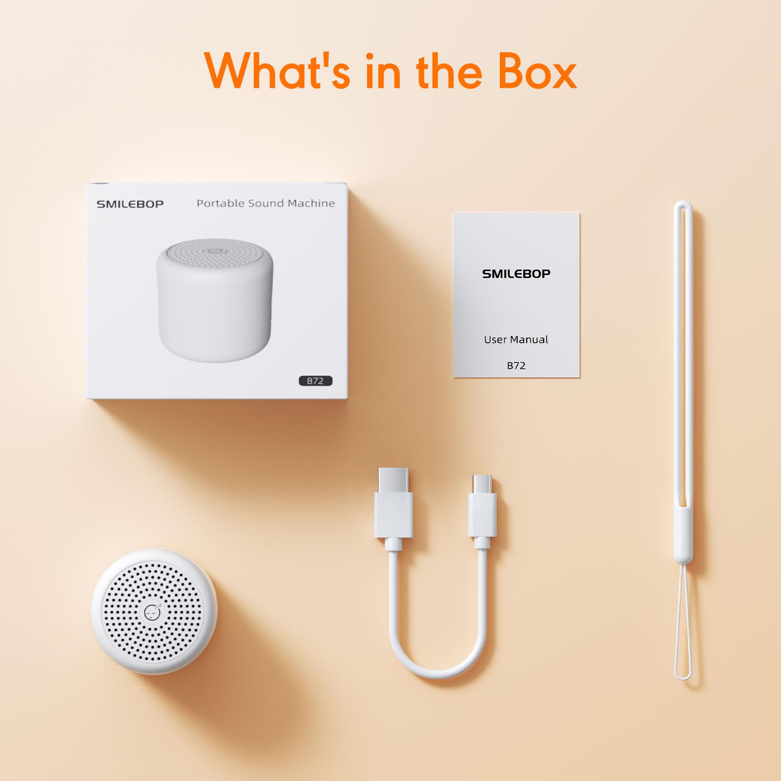 SMILEBOP miniature white noise machine held in an adult hand