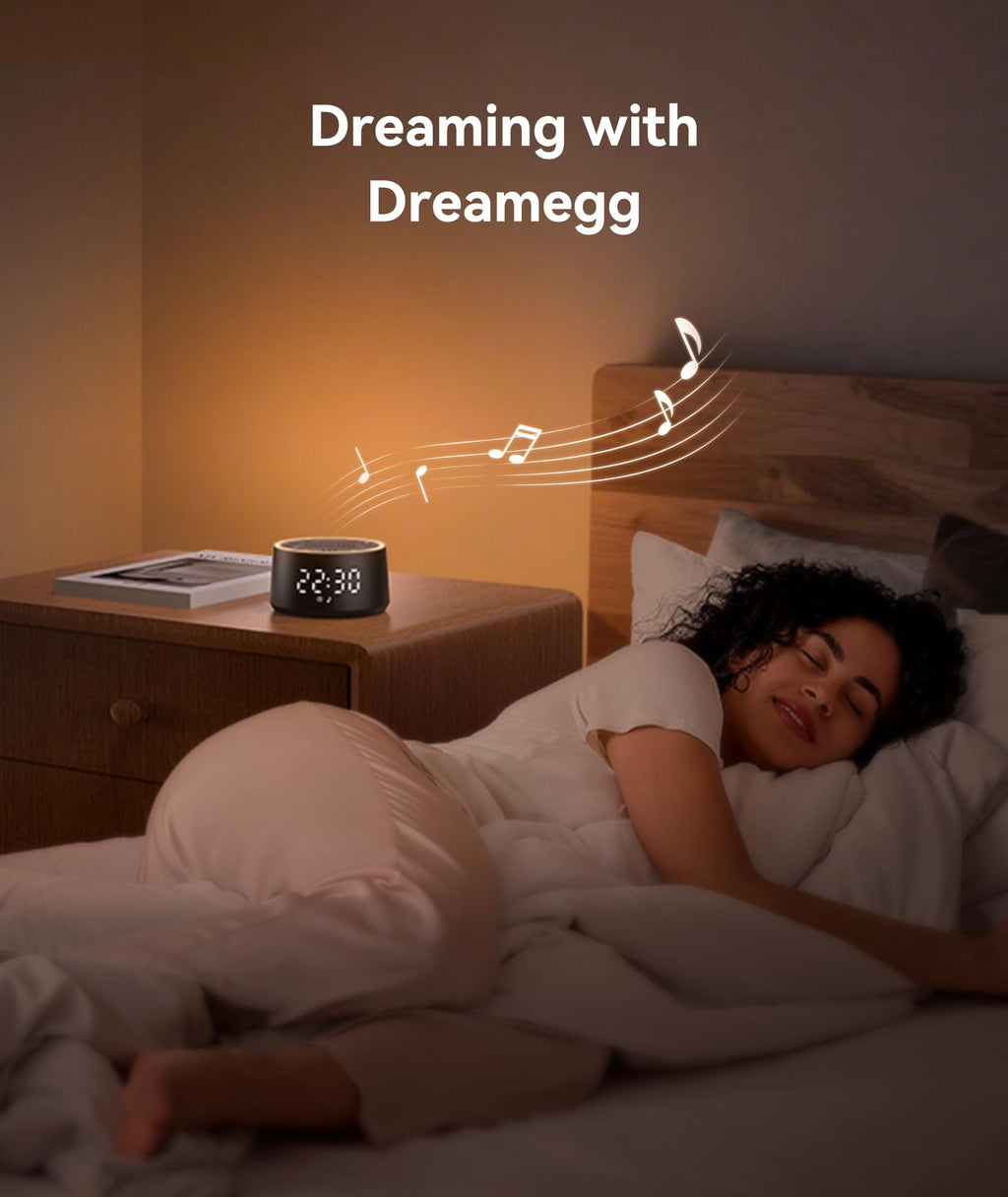 Compact Dreamegg travel sound machine placed on a modern bedroom nightstand side view