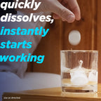 Alka-Seltzer tablets dissolving in a glass of water