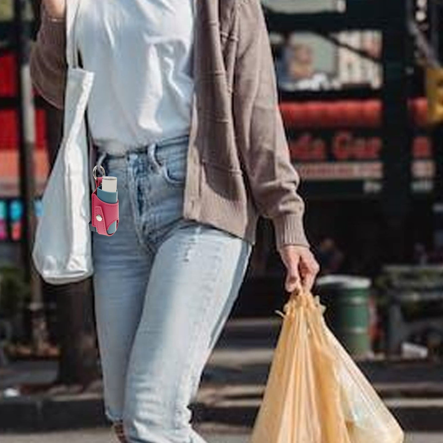 LeoTube premium imported asthma medication carrier sleeve hanging securely from a belt loop