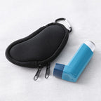 Koikyu protective inhaler sleeve displaying the integrated metal carabiner clip