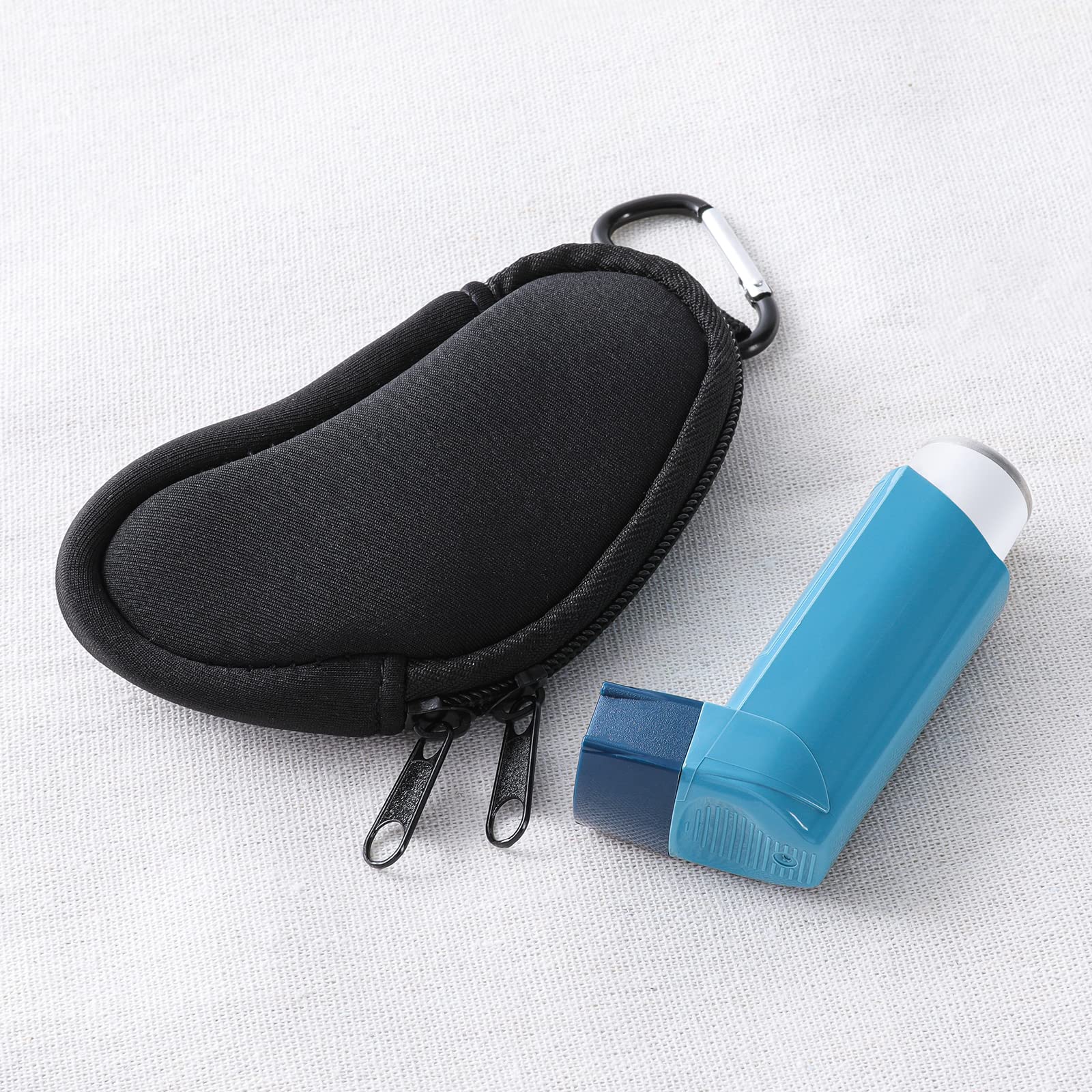 Koikyu protective inhaler sleeve displaying the integrated metal carabiner clip