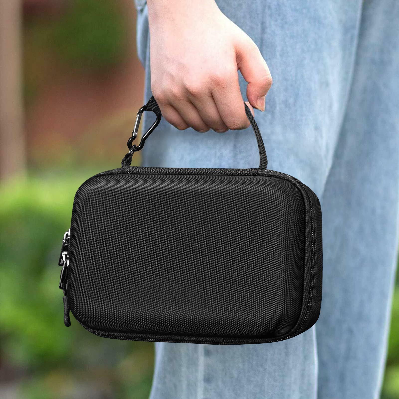 Elonbo handheld atomizer travel case being carried by the convenient wrist strap