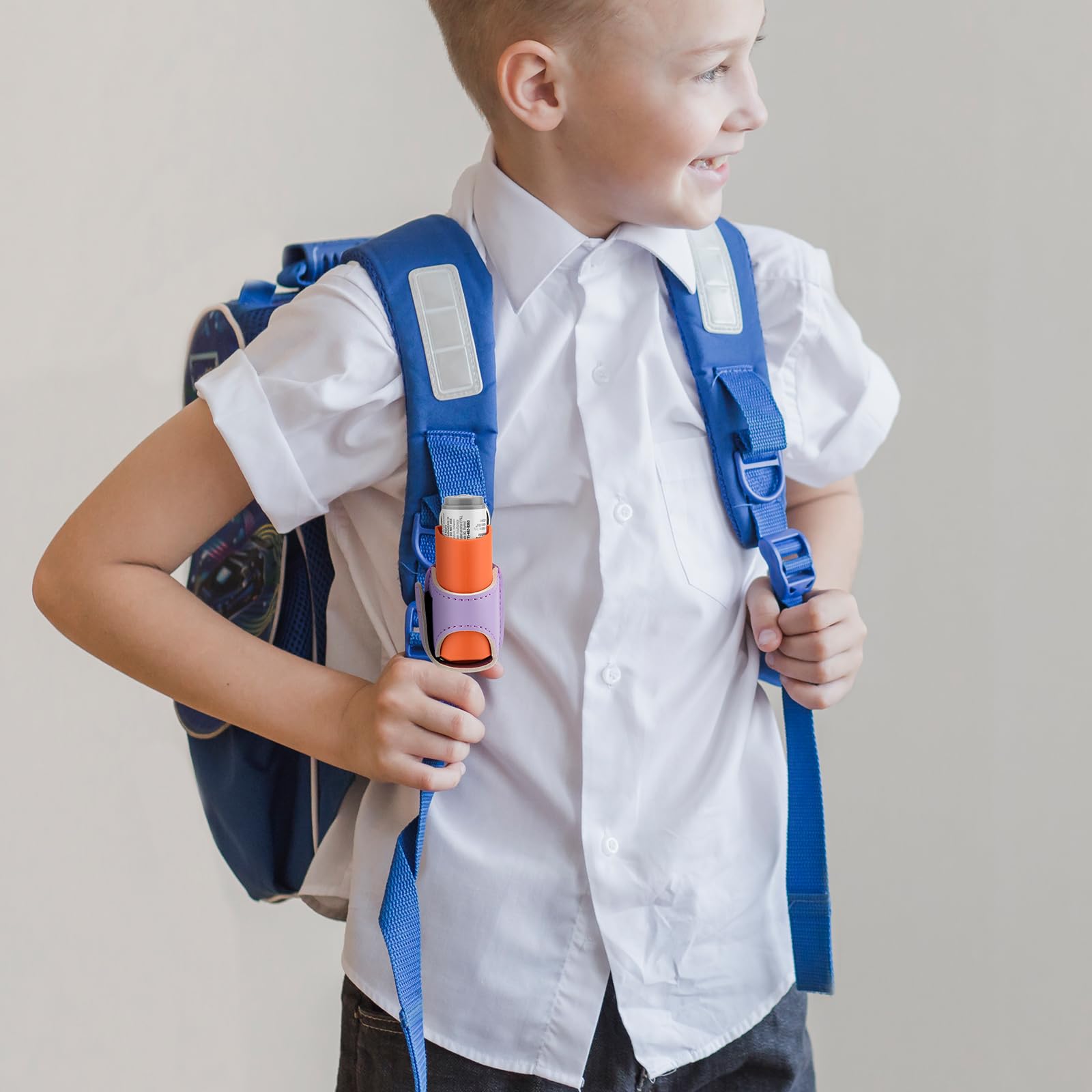 Purple polyurethane leather inhaler holder attached to a travel backpack zipper loop for easy access.