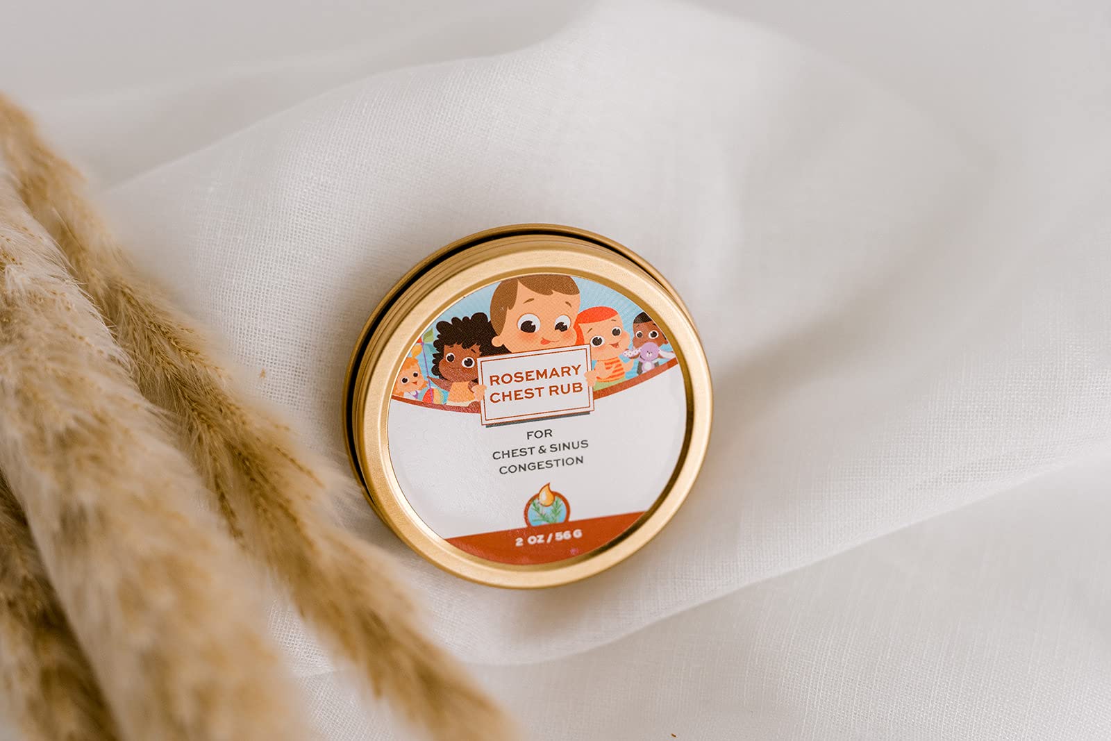 Applying natural baby chest rub onto infant feet for comfort