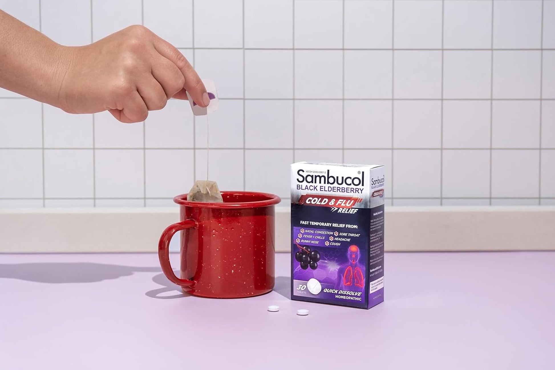 Sambucol black elderberry homeopathic medicine box demonstrating waterless quick dissolve feature.