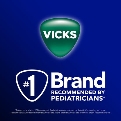 Demonstration view of a Vicks vapor pad being handled carefully for device insertion