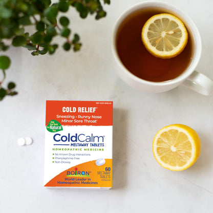 Close up view of Boiron ColdCalm unflavored tablets for sneezing and runny nose.