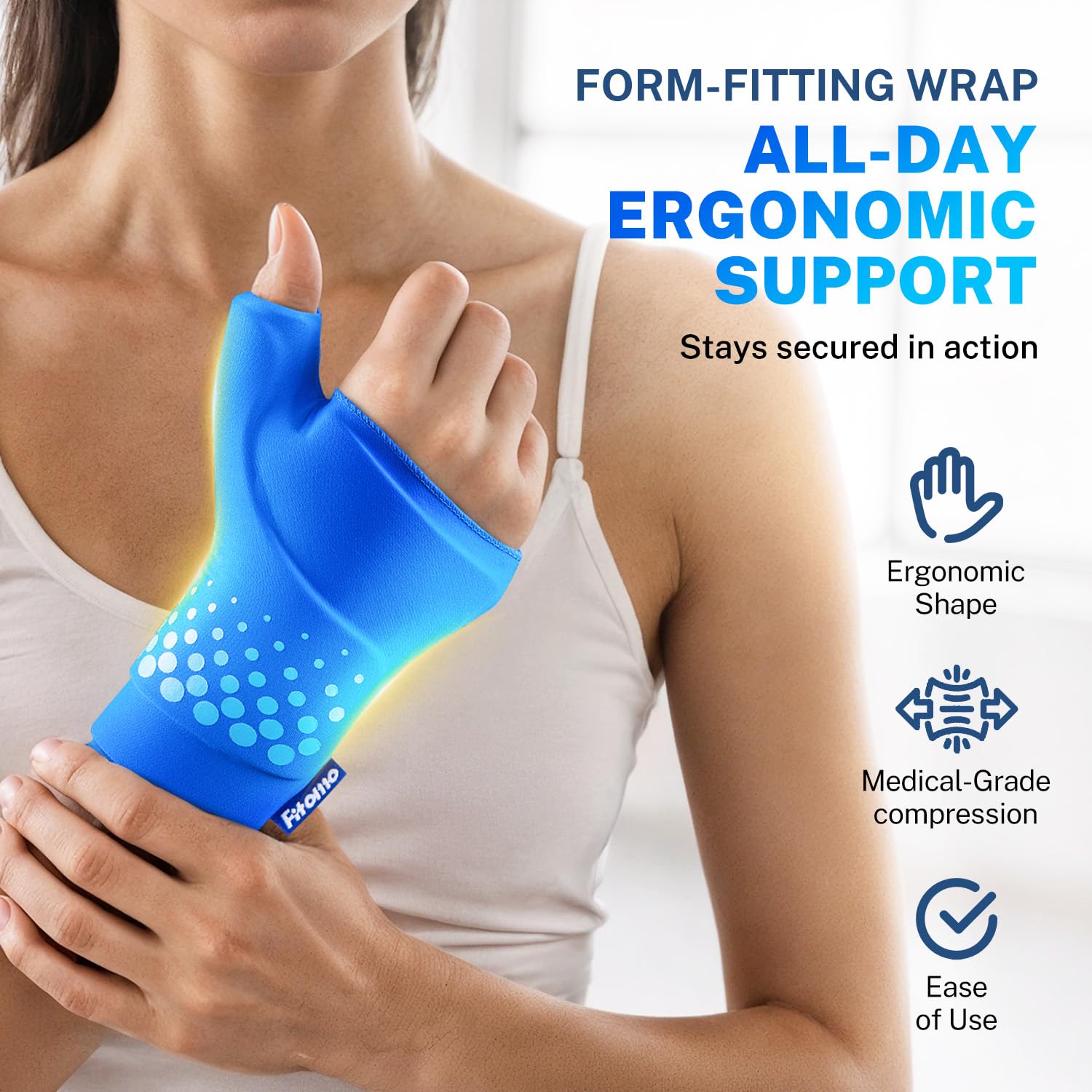 Person using Fitomo thumb and wrist ice pack while working at computer