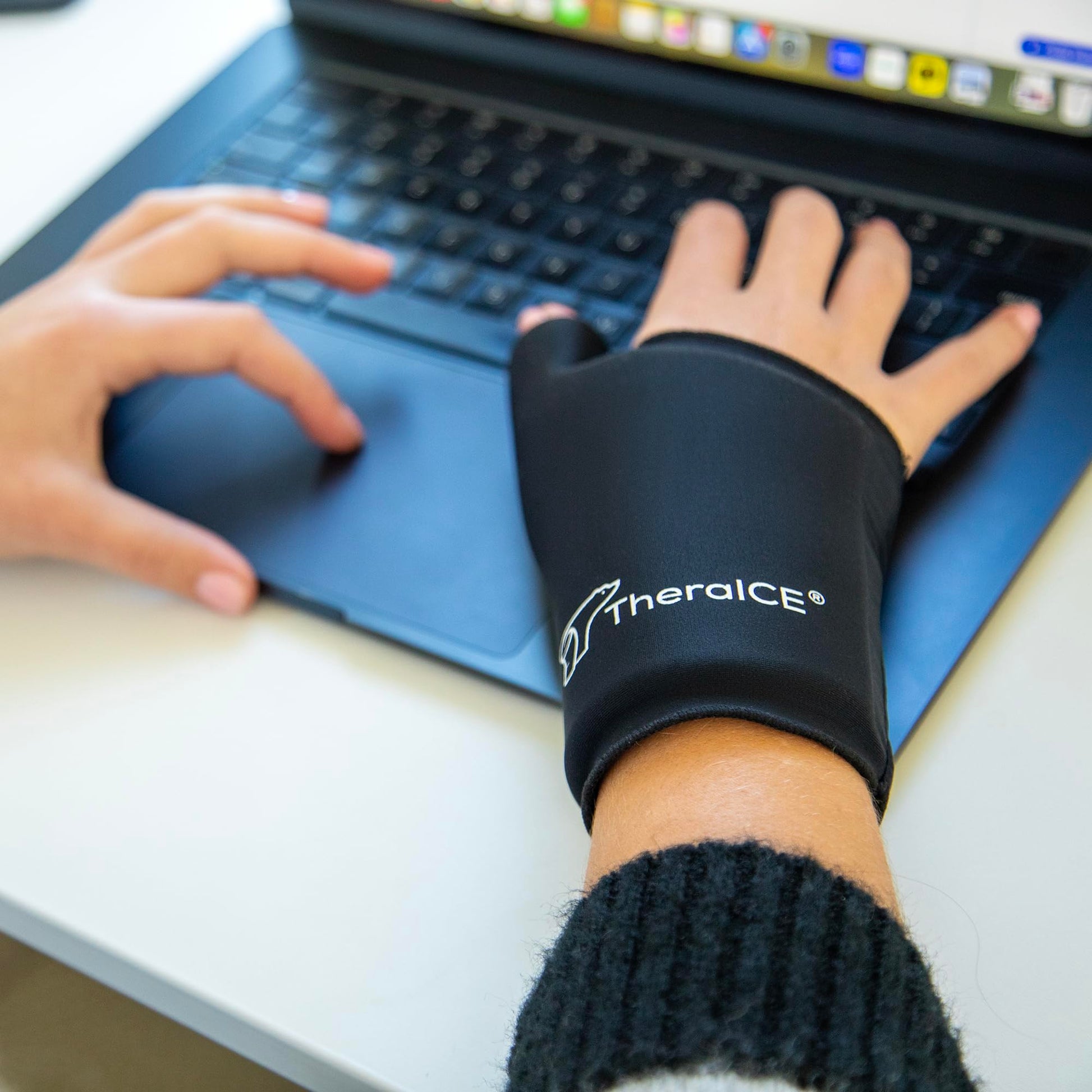 Person using TheraICE wrist wrap for wrist support