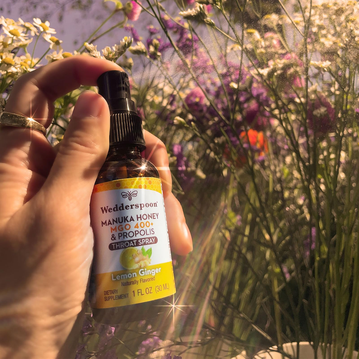 Side view of Wedderspoon lemon and ginger throat spray packaging