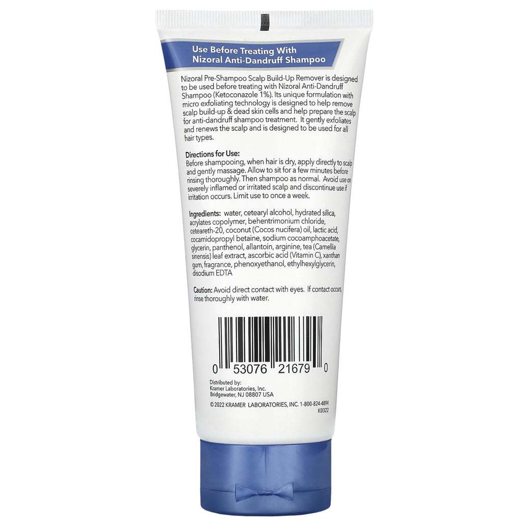 Lifestyle presentation of Nizoral scalp build-up remover bottle