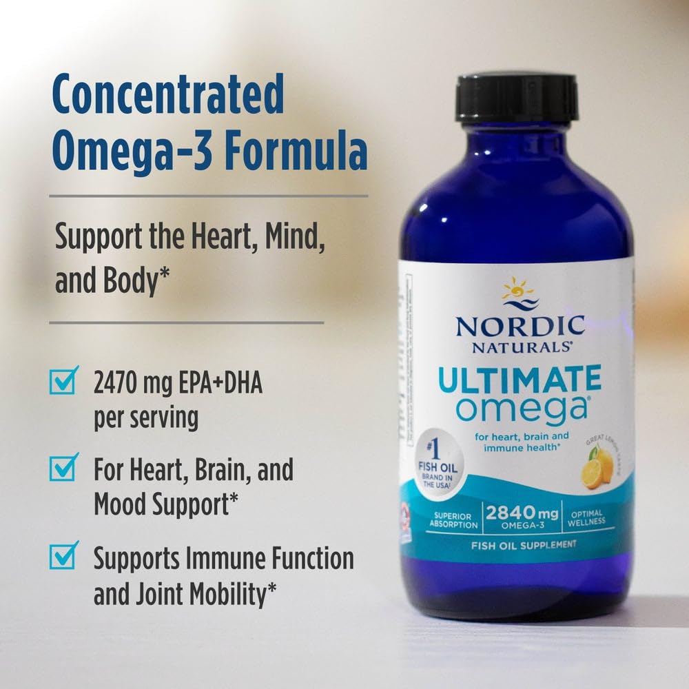 Nordic Naturals high potency fish oil liquid pouring out to demonstrate clean consistency and lemon flavor variant.
