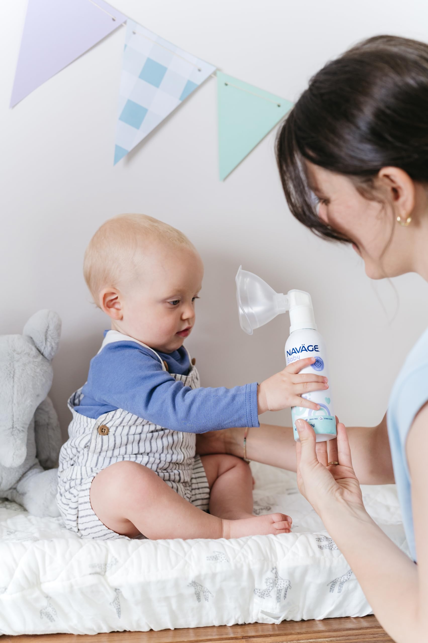 Infant nasal spray kit displaying the micro mist can nozzle adapter and clear mask