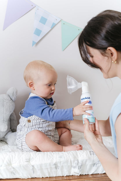 Infant nasal spray kit displaying the micro mist can nozzle adapter and clear mask