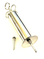 Close up of Cynamed metal ear syringe tapered and bulbous tips