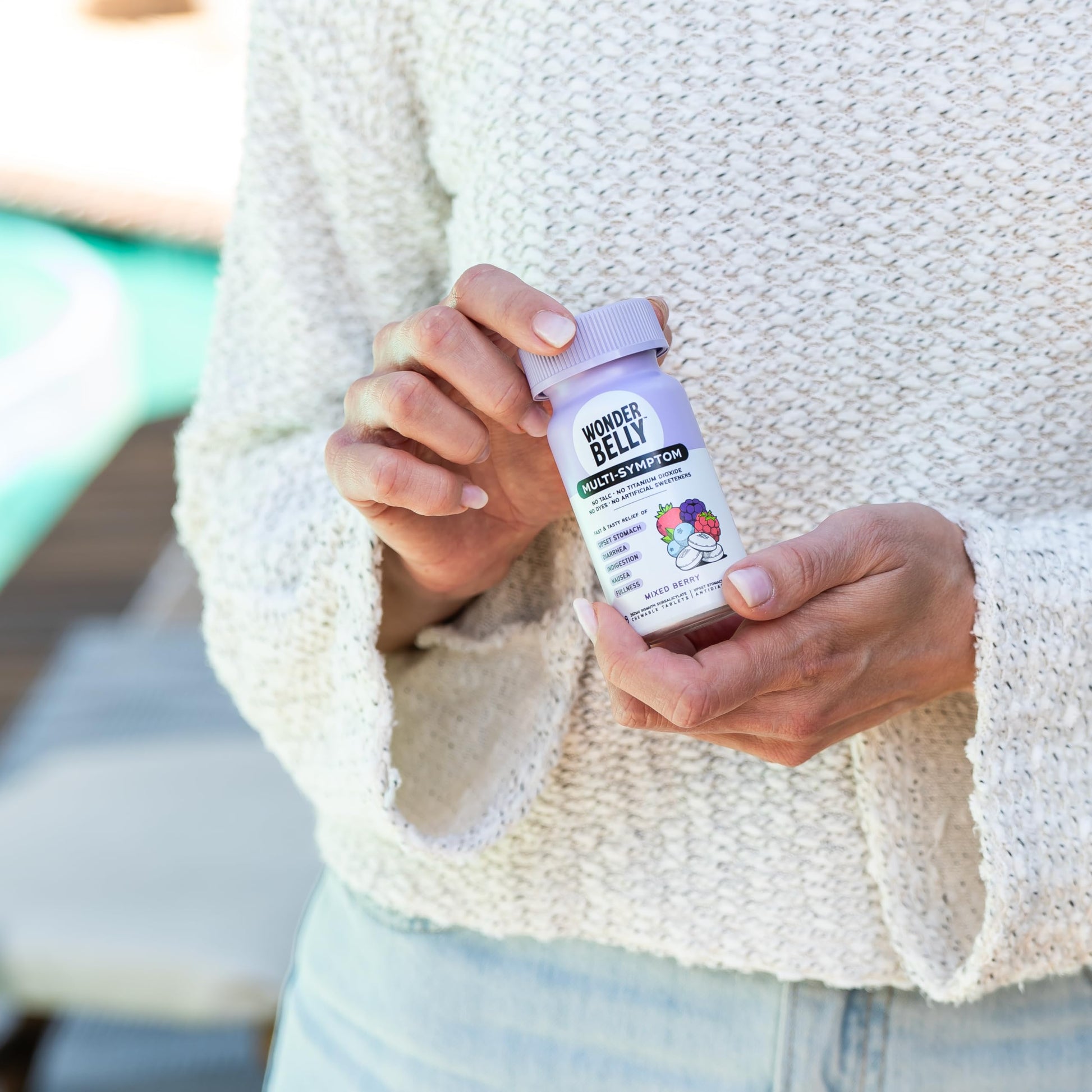 Wonderbelly multi symptom medicine recyclable bottle side panel with drug facts.