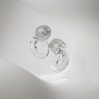 Person wearing Loop Engage 2 clear earplugs during conversation