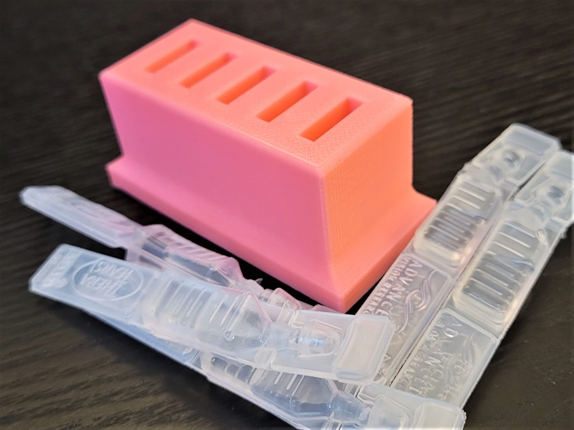 Znet3D plastic single use eye care vial tray placed neatly inside a domestic refrigerator corner