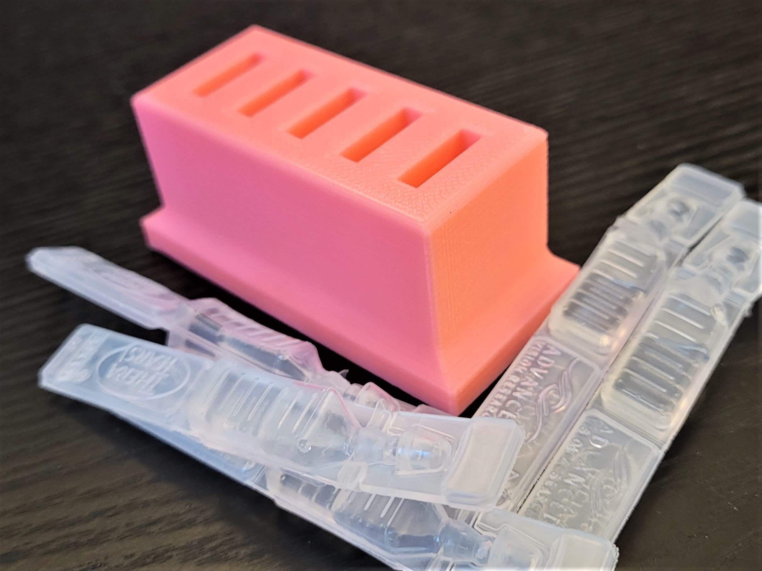 Znet3D plastic single use eye care vial tray placed neatly inside a domestic refrigerator corner