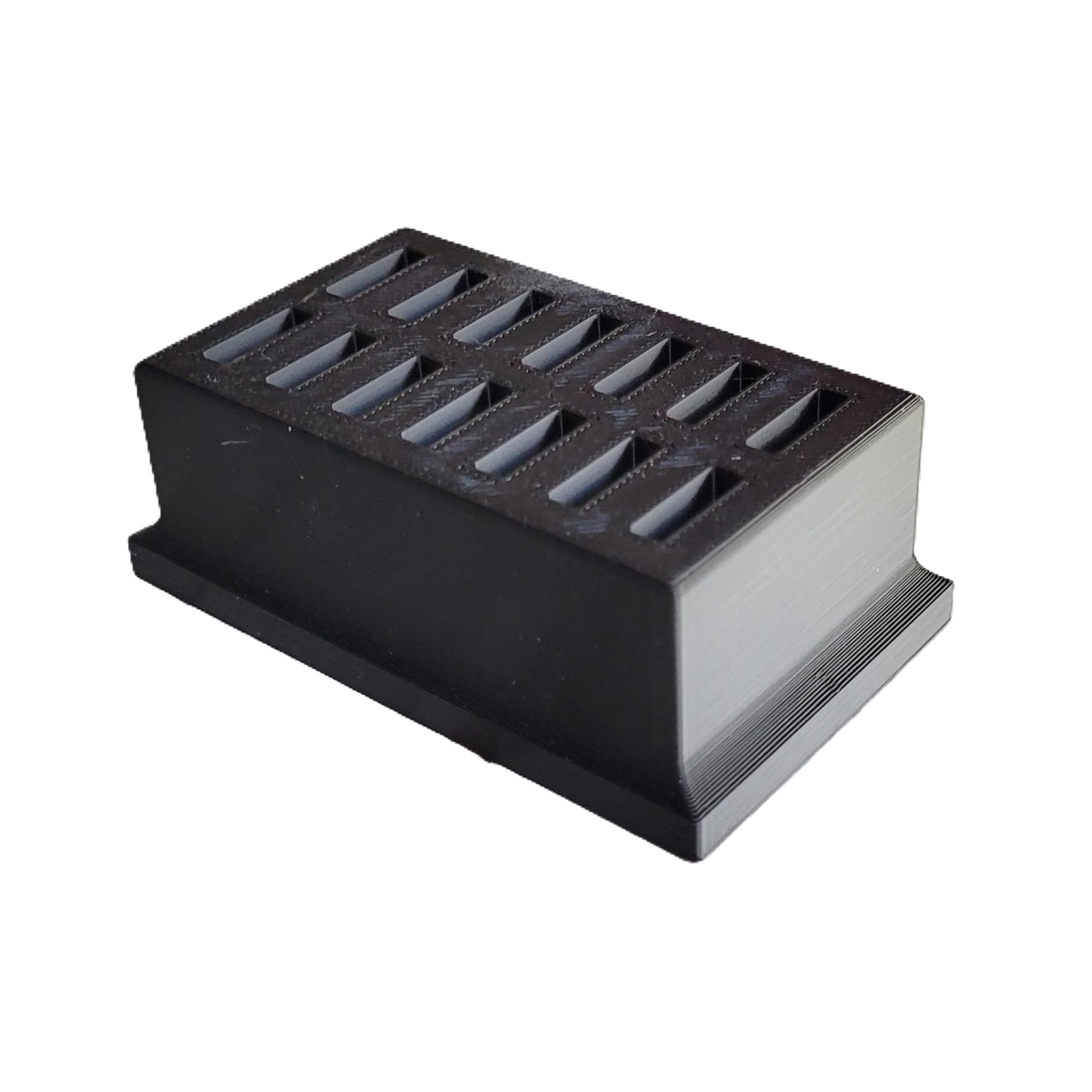 Compact black 3D printed eye drop storage tray placed on a clean counter space