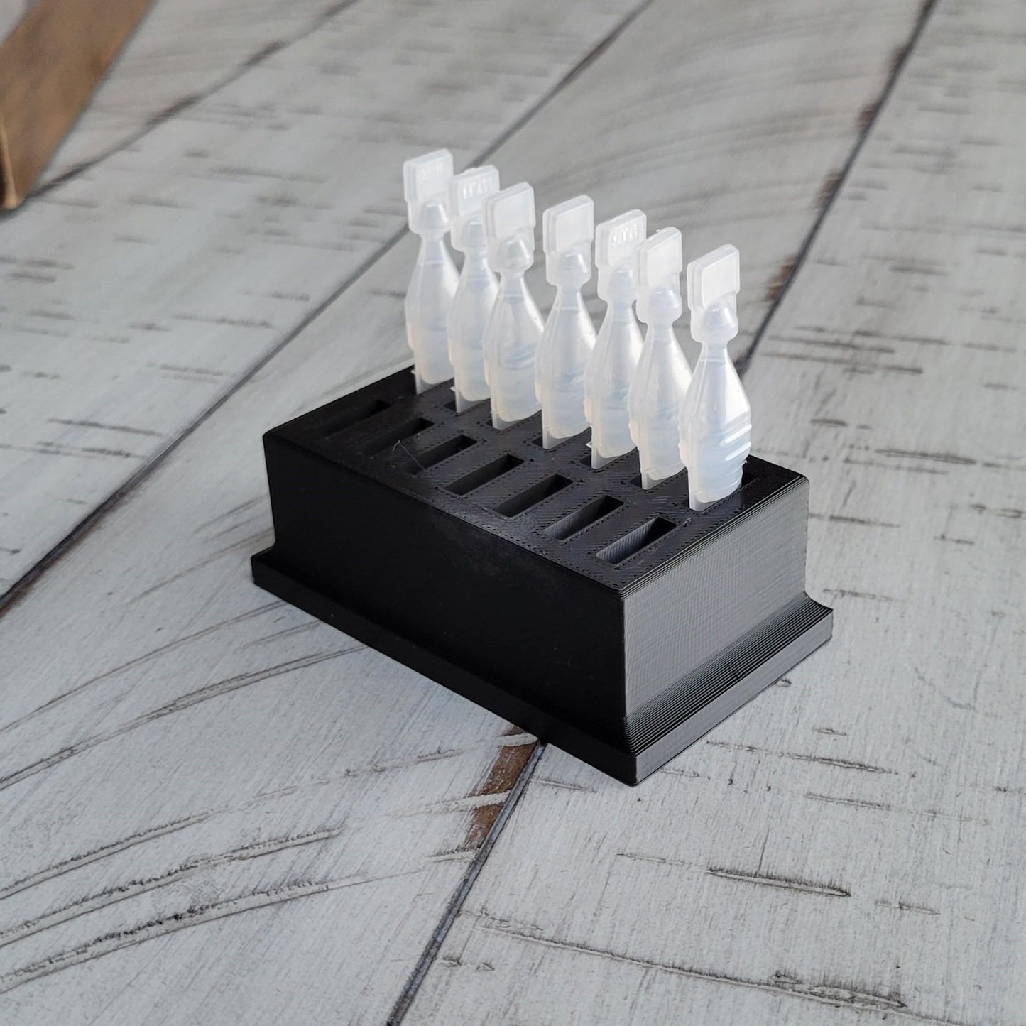 Premium USA imported single use eye drop vial organizer stored inside a refrigerator shelf