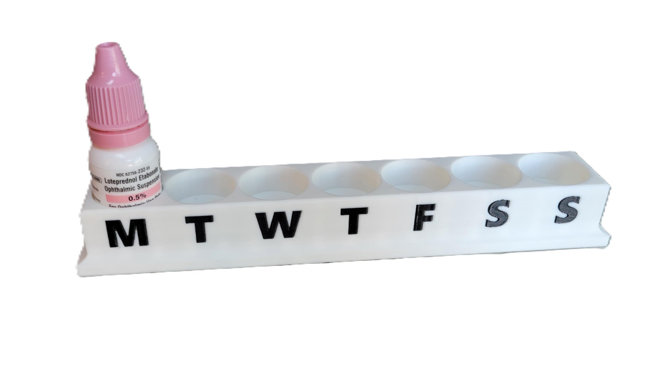 Top down view of the six slot upright eye care bottle holder showing slot spacing and design.
