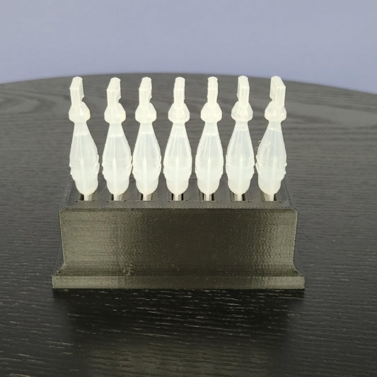 Side angle view of the 3D printed disposable eye drop container storage unit in matte black plastic.