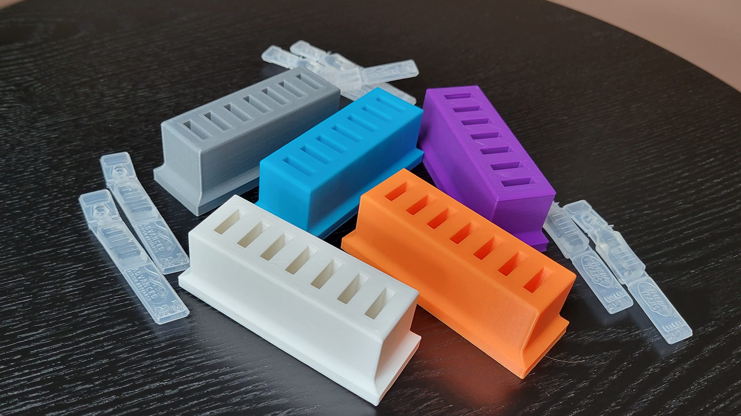 Compact black Znet3D eye care organizer placed on a clean counter surface illustrating stable upright storage.