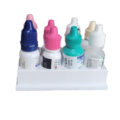Top down perspective of the white 8-slot eye care holder setup