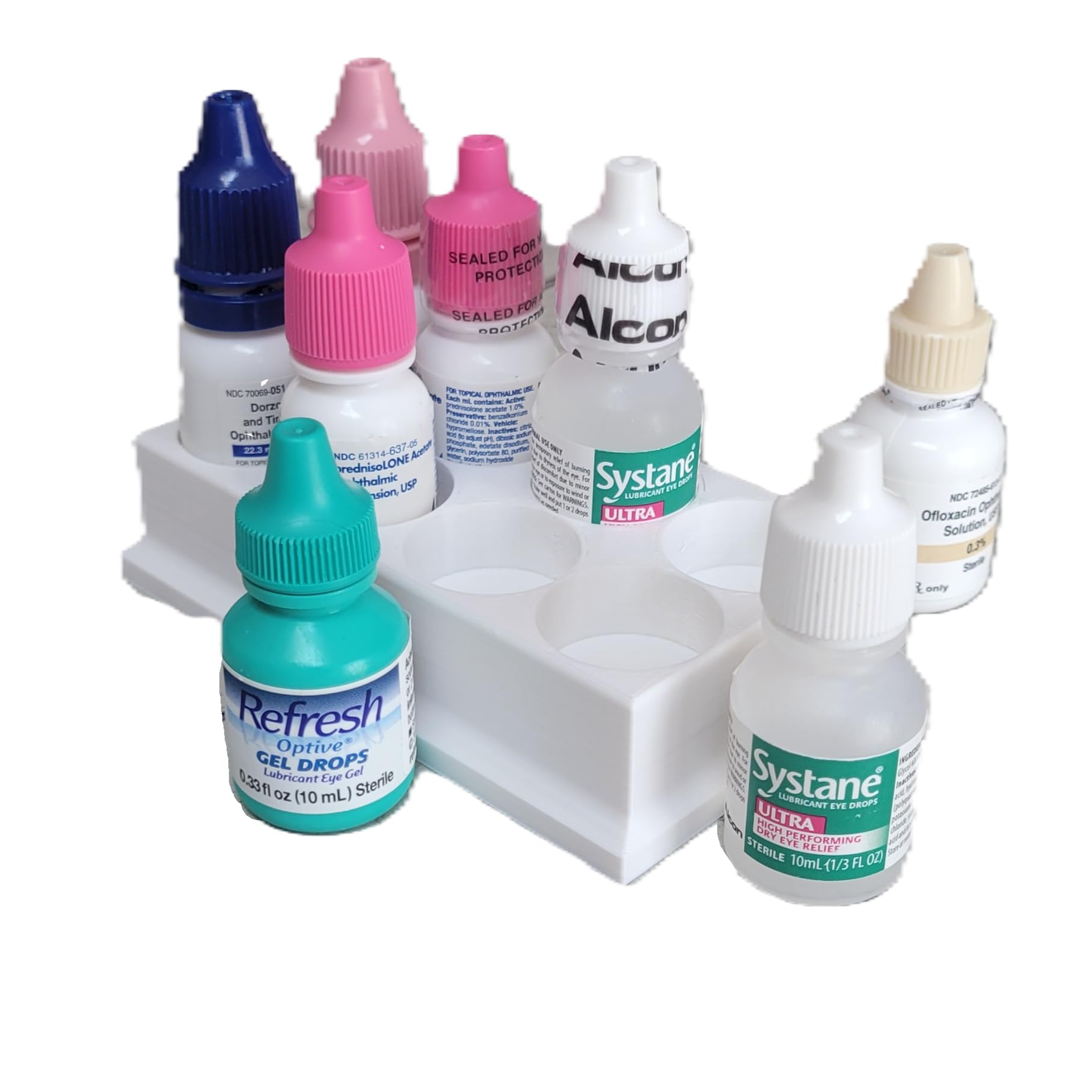 Compact white plastic ophthalmic dropper storage base on a nightstand