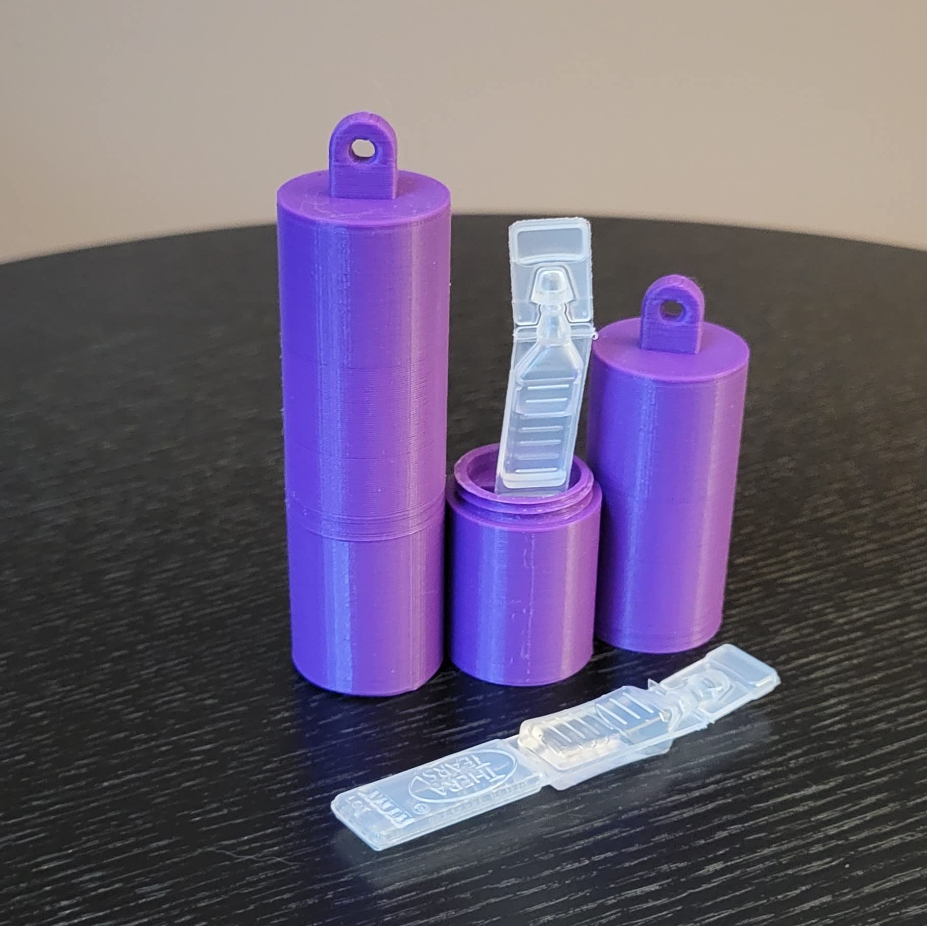 Purple 3D printed single use eye drop vial carrier with keychain loop
