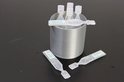 Side view of silver biodegradable PLA plastic eye drop container