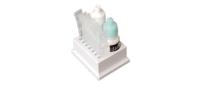 Compact purple Znet3D medical vial stand placed inside a refrigerator door shelf for chilled drops