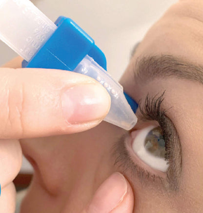 XactDrop reusable eye drop targeting tool inside its compact travel storage bag.