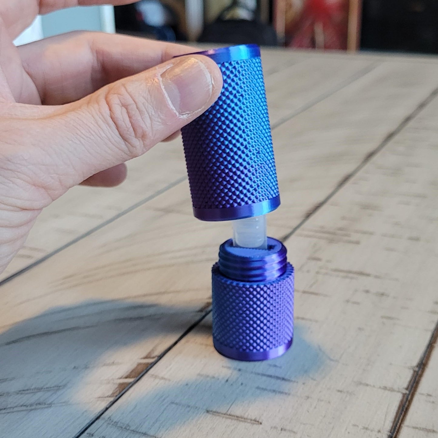 Znet3D single use vial holder being placed inside a purse slot