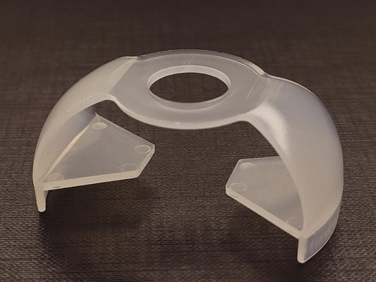 EZ Squeeze Eye Drop Bottle Dispenser attached to a medicine bottle demonstrating how the lever wings work