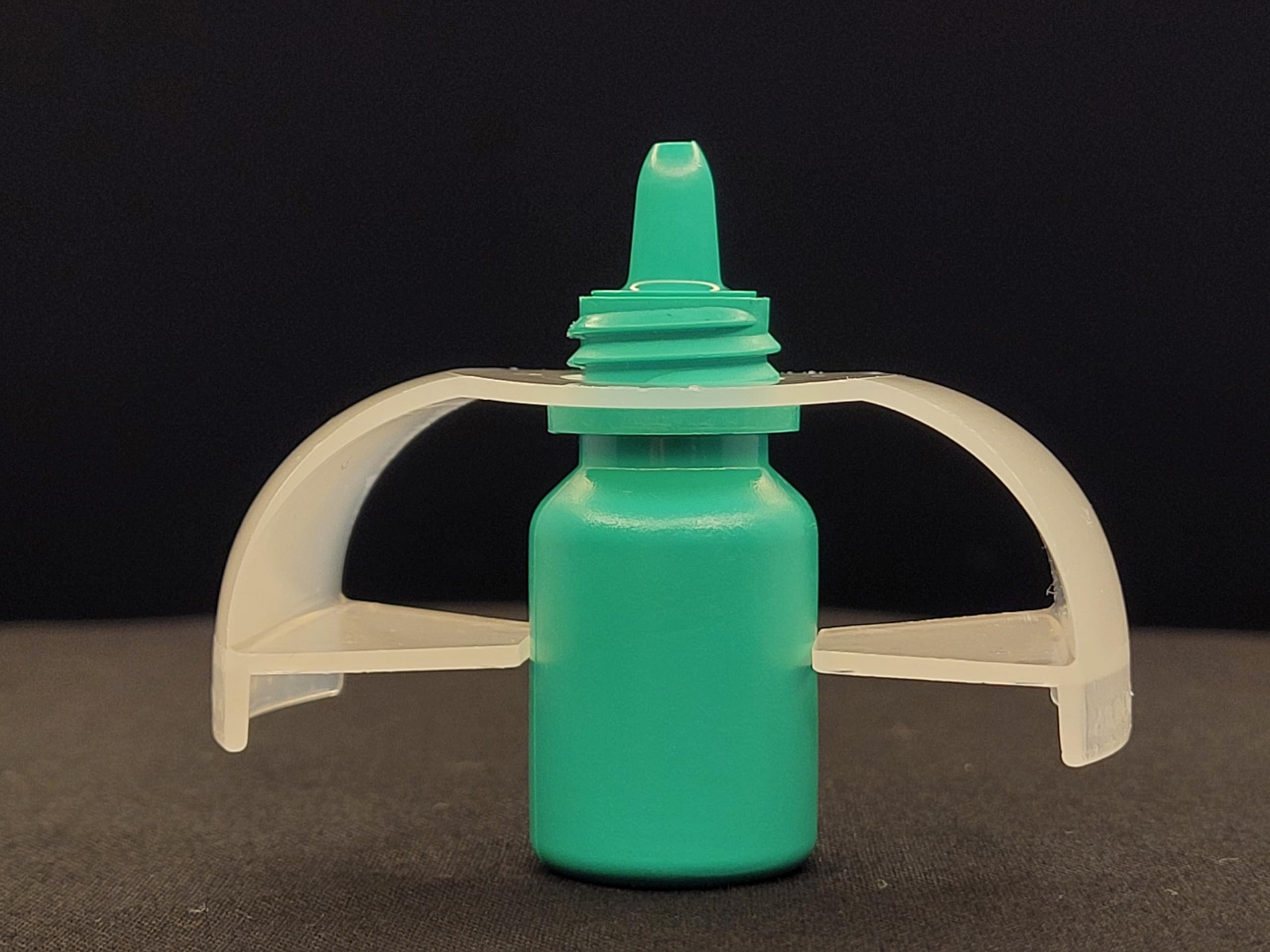 EZ Squeeze Eye Drop Bottle Squeezer side angle displaying the ergonomic grip profile for arthritis patients