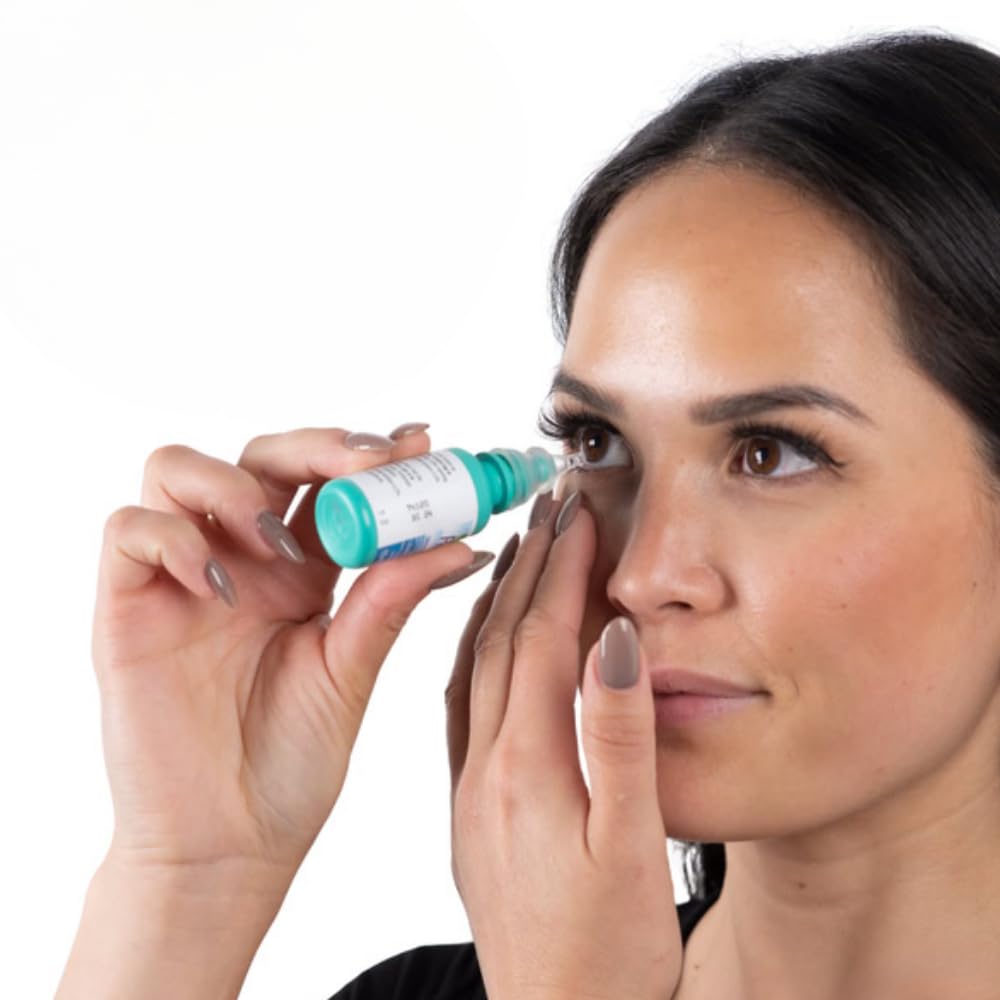 Clear flexible eye drop guide attached to a standard squeeze medicine bottle