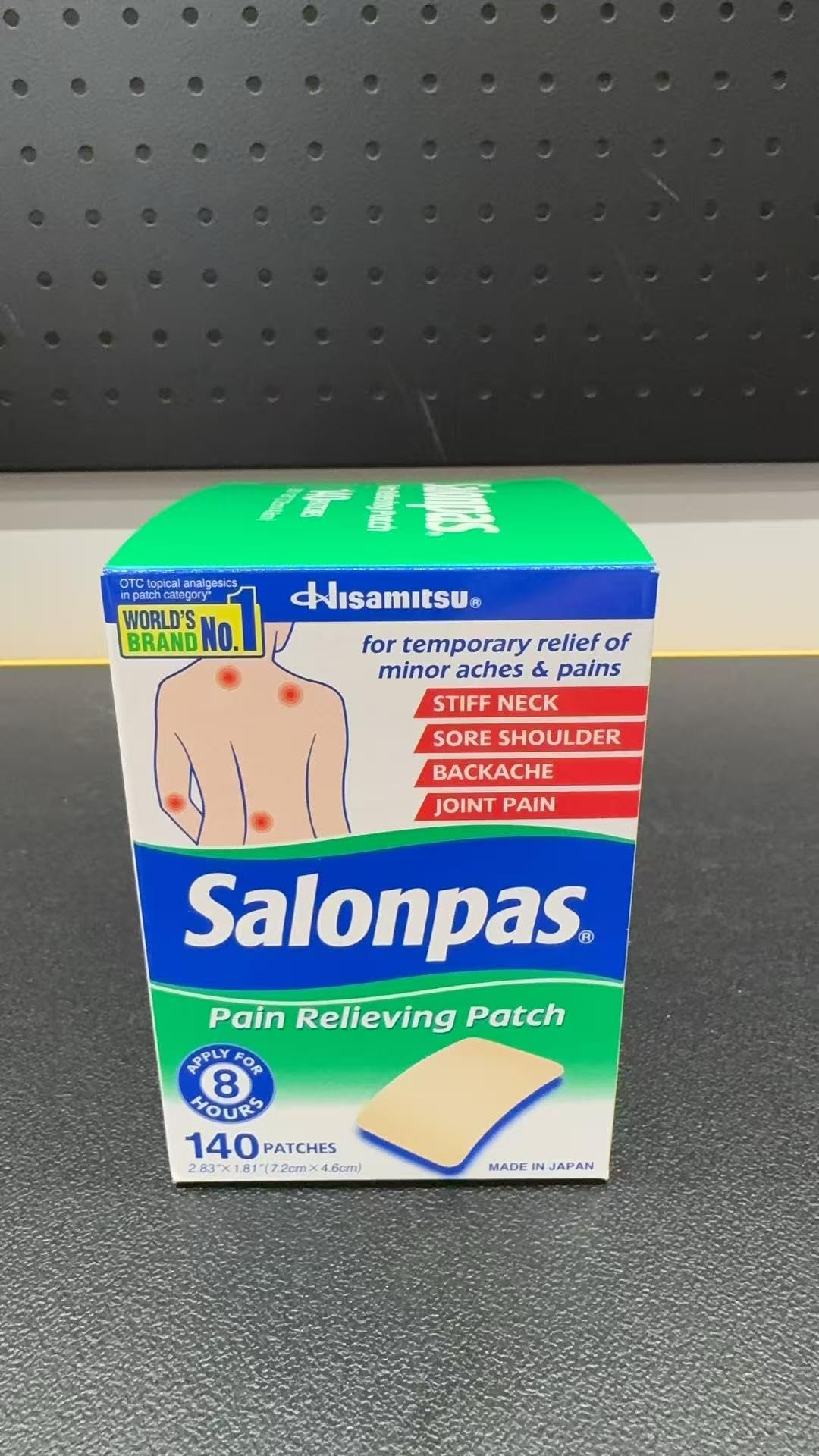 Close up of Salonpas box highlighting twelve hour relief benefits