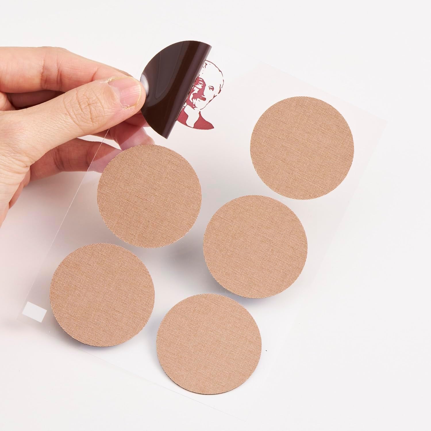 Nichiban medicated warming plaster sheets showing the 3.9 centimeter circular design for targeting broad back pain areas.