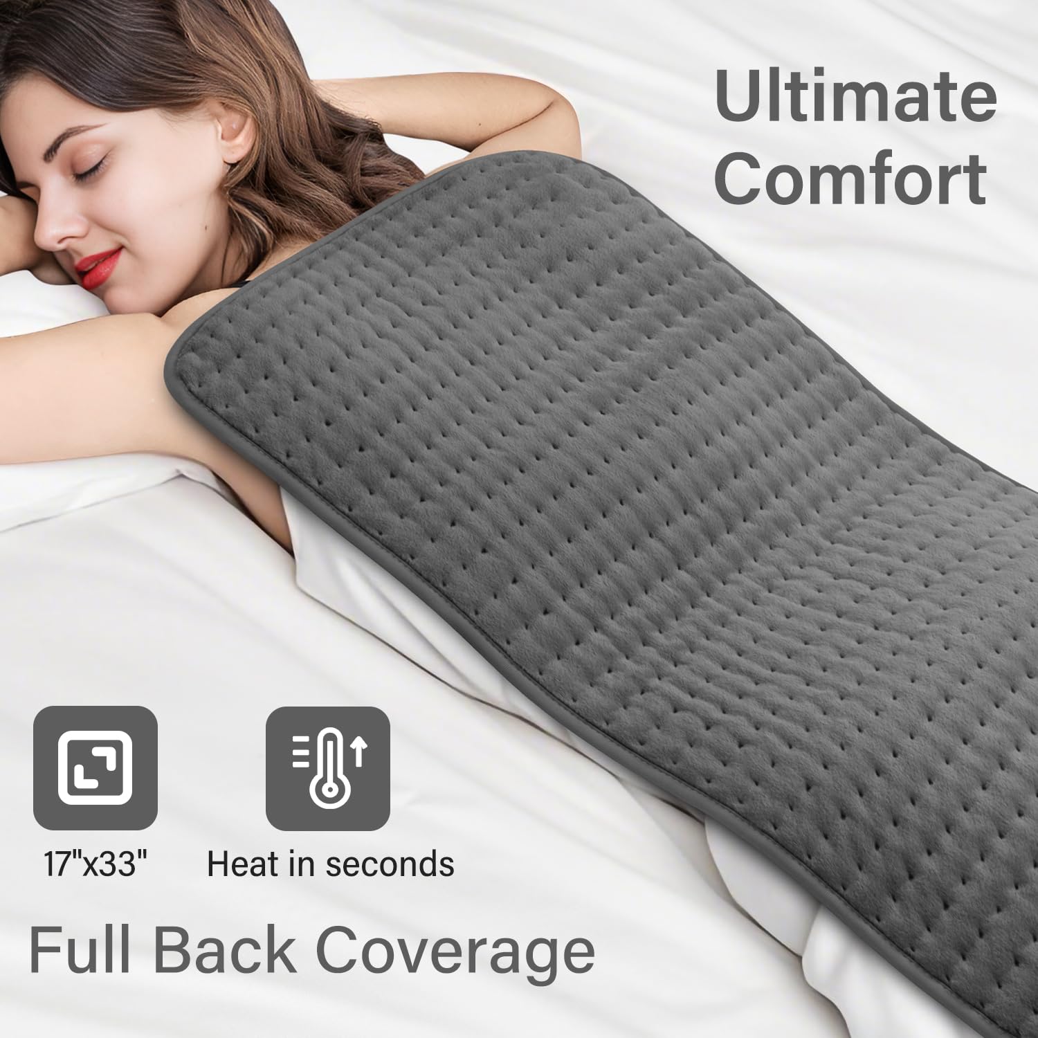 Extra large 17 by 33 inch king size electric heat pad draped over a person's back for pain relief