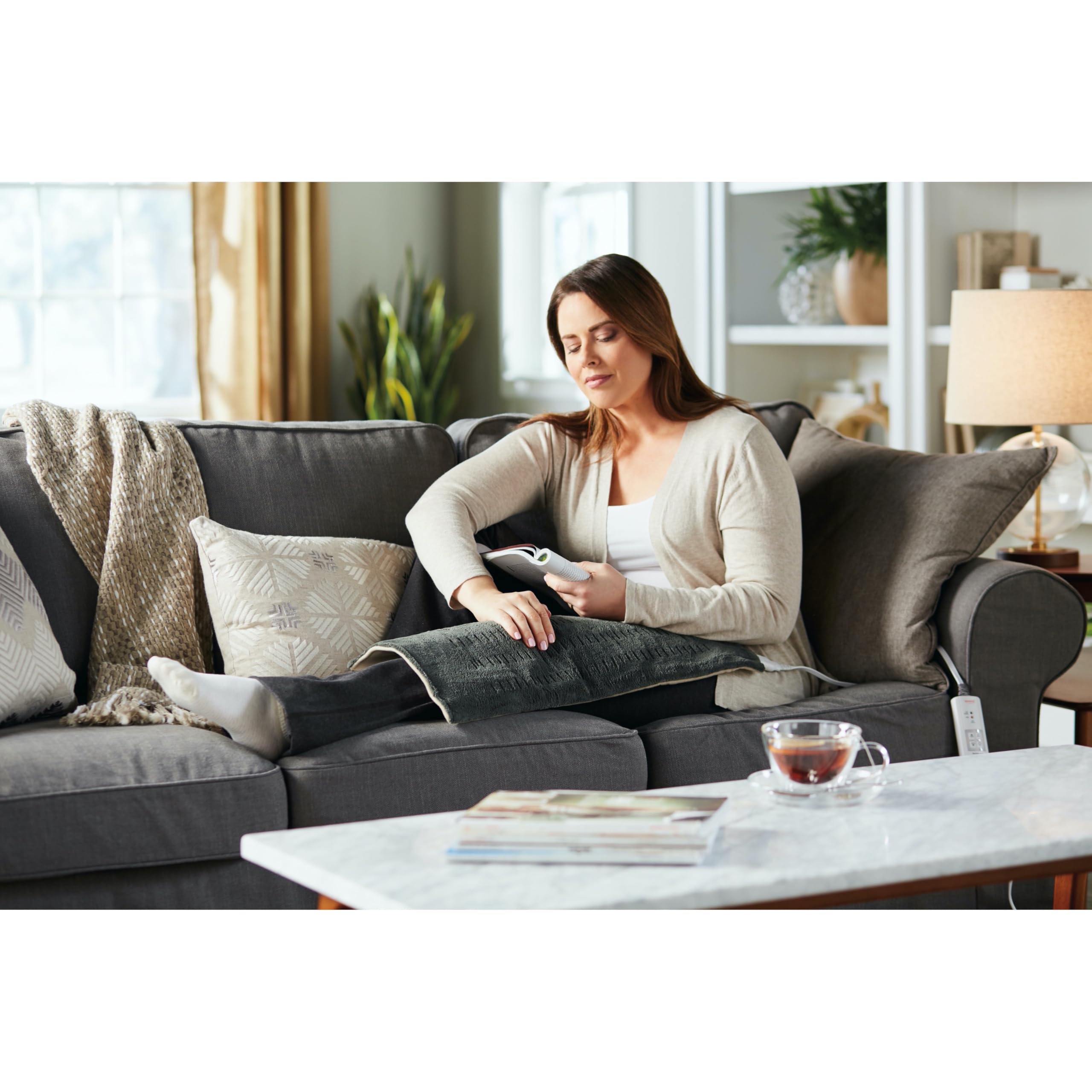 Sunbeam green microplush fabric heating pad highlighting machine washable care feature.