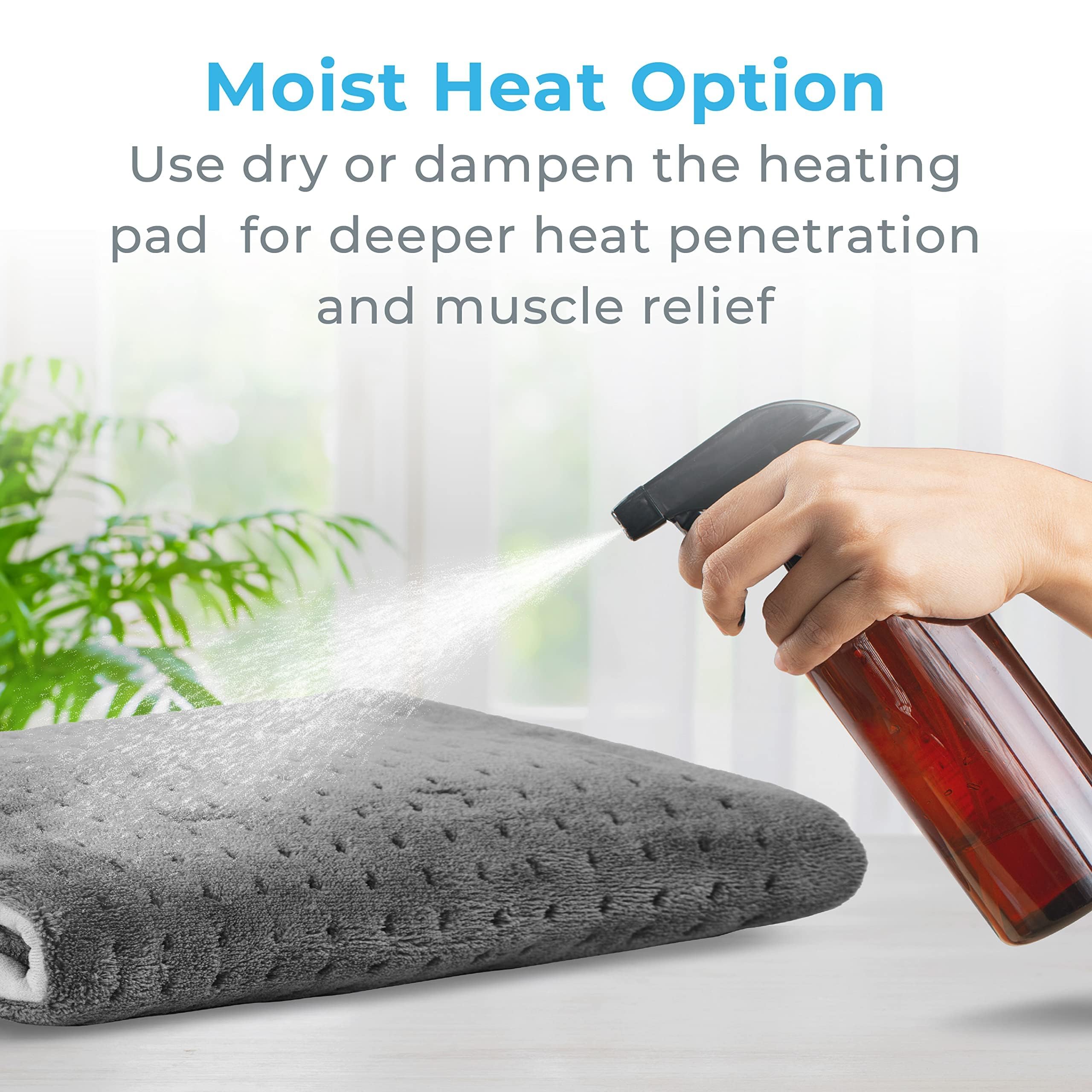 Gray PureRelief heating pad laid flat demonstrating maximum coverage size