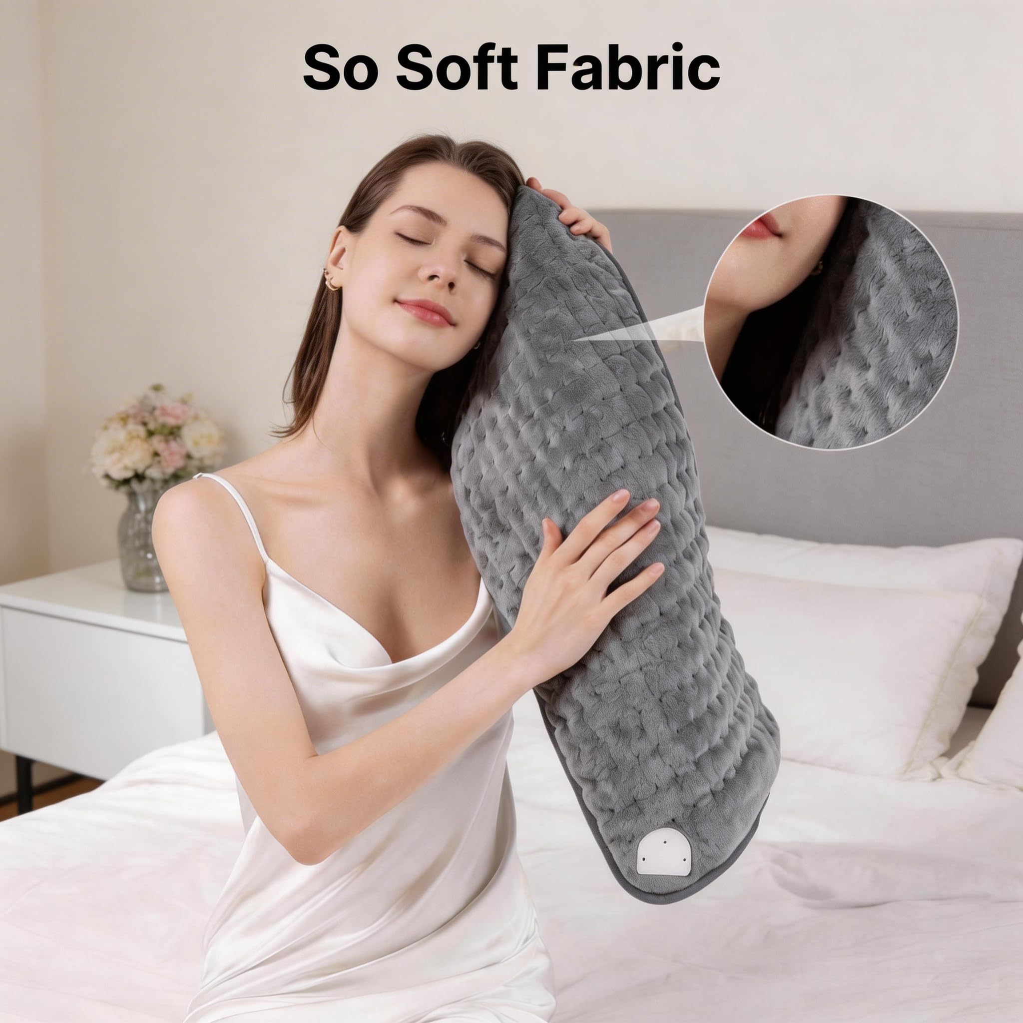 Soft grey therapeutic pad being lightly sprayed with water mist to activate the advanced moist heat option.