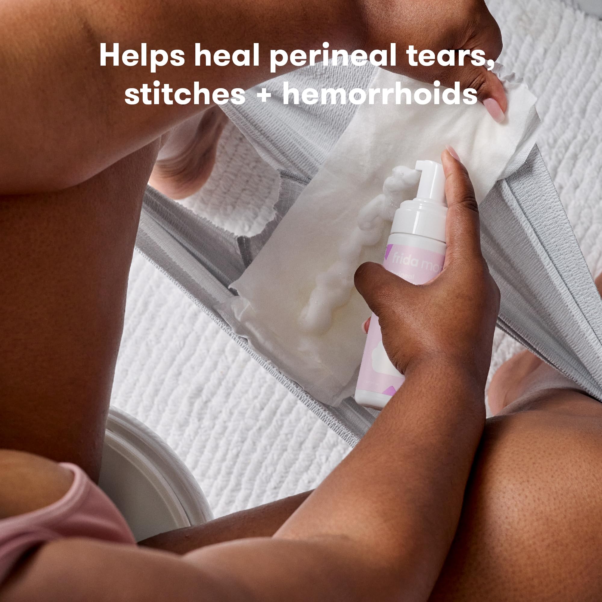 Frida Mom perineal healing foam bottle displaying product ingredients