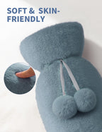 Noble Gray rubber heating pad being filled carefully to two thirds capacity with warm water.