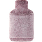 Samply hot water bottle with pink cover being used as a soothing hand and feet warmer.